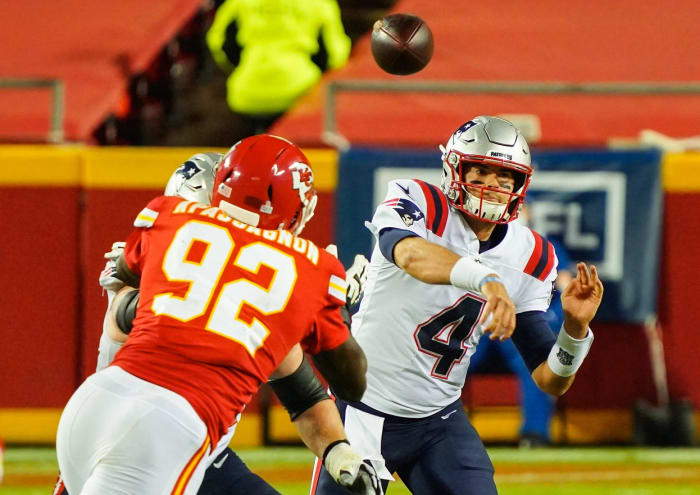 New England quarterback Jarrett Stidham (4) throws a pass as Chiefs defensive end Tanoh Kpassagnon (92) defends. Mandatory Credit: Jay Biggerstaff-USA TODAY